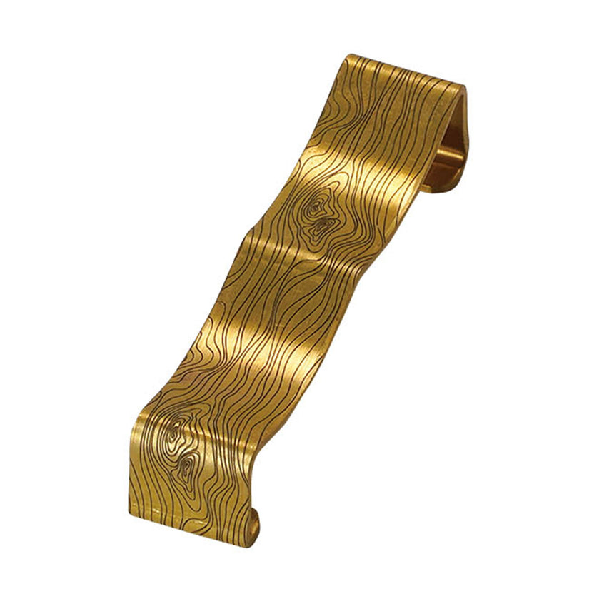 Brass bent cutlery rest with wood grain pattern