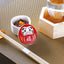 Daruma-shaped lidded delicacy container